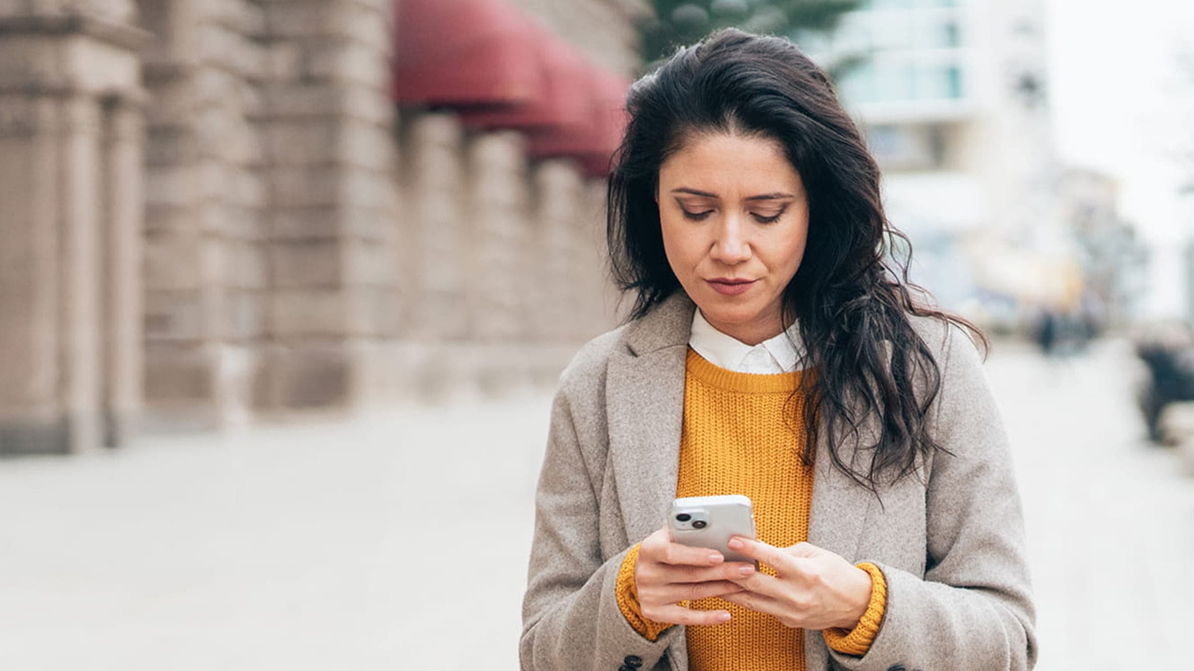 Woman with phone 16:9